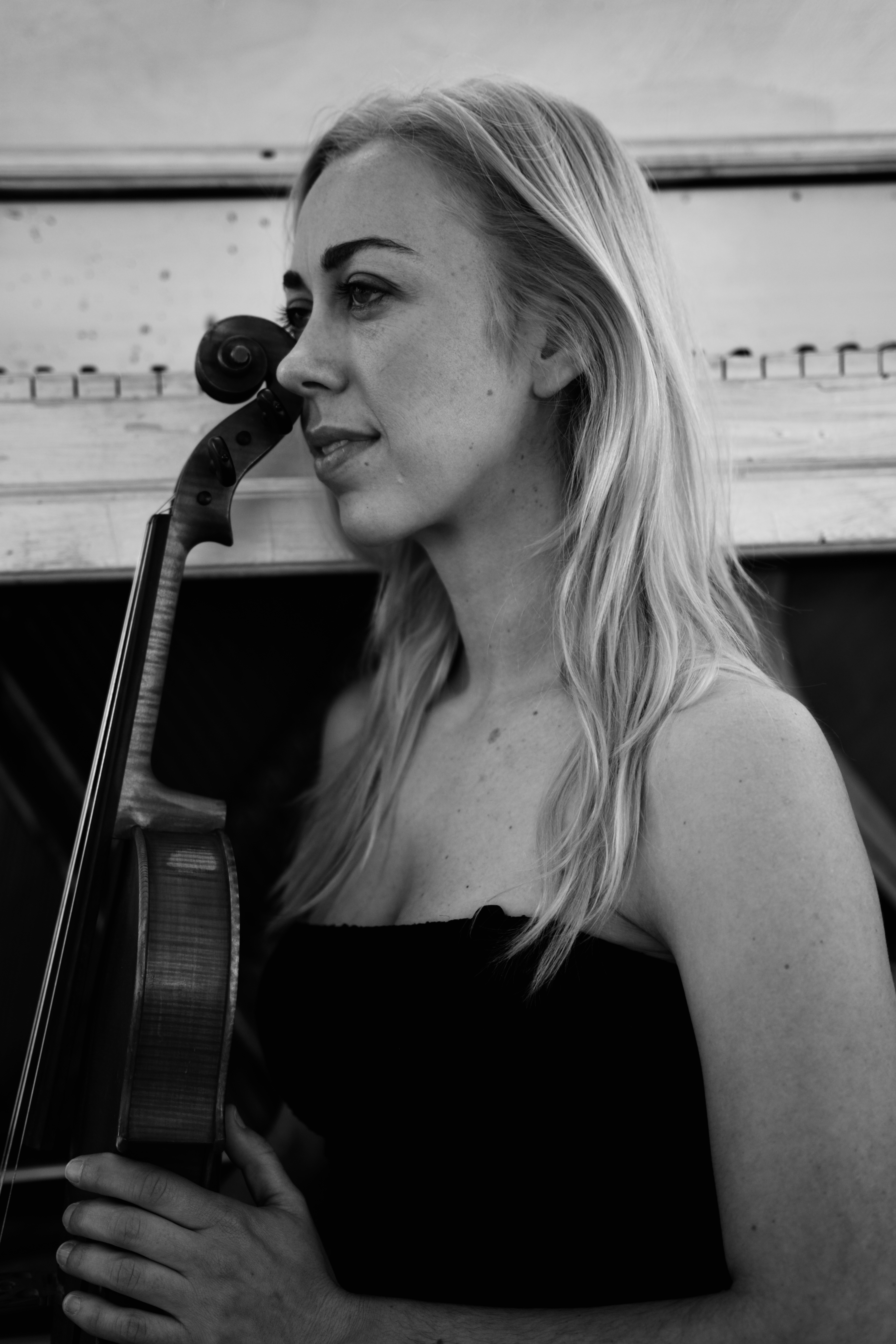 Paula Karolak holding a viola